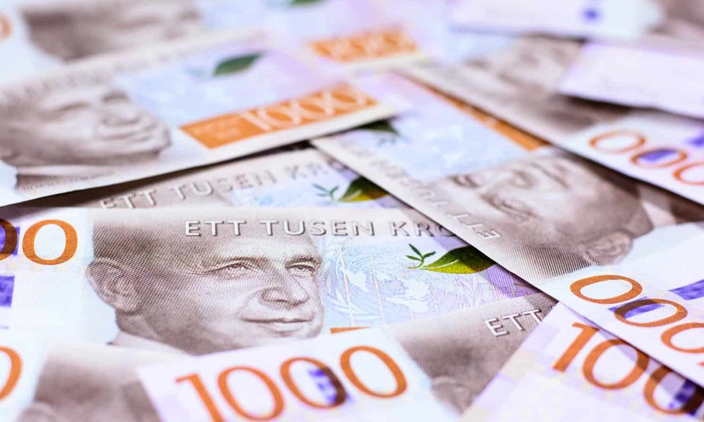 Success and got profit from business with beautiful background and texture of Swedish kronor currency, money new series banknotes ,Focus on eye of a man on banknote